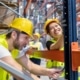 workers learning how to assemble warehouse shelving