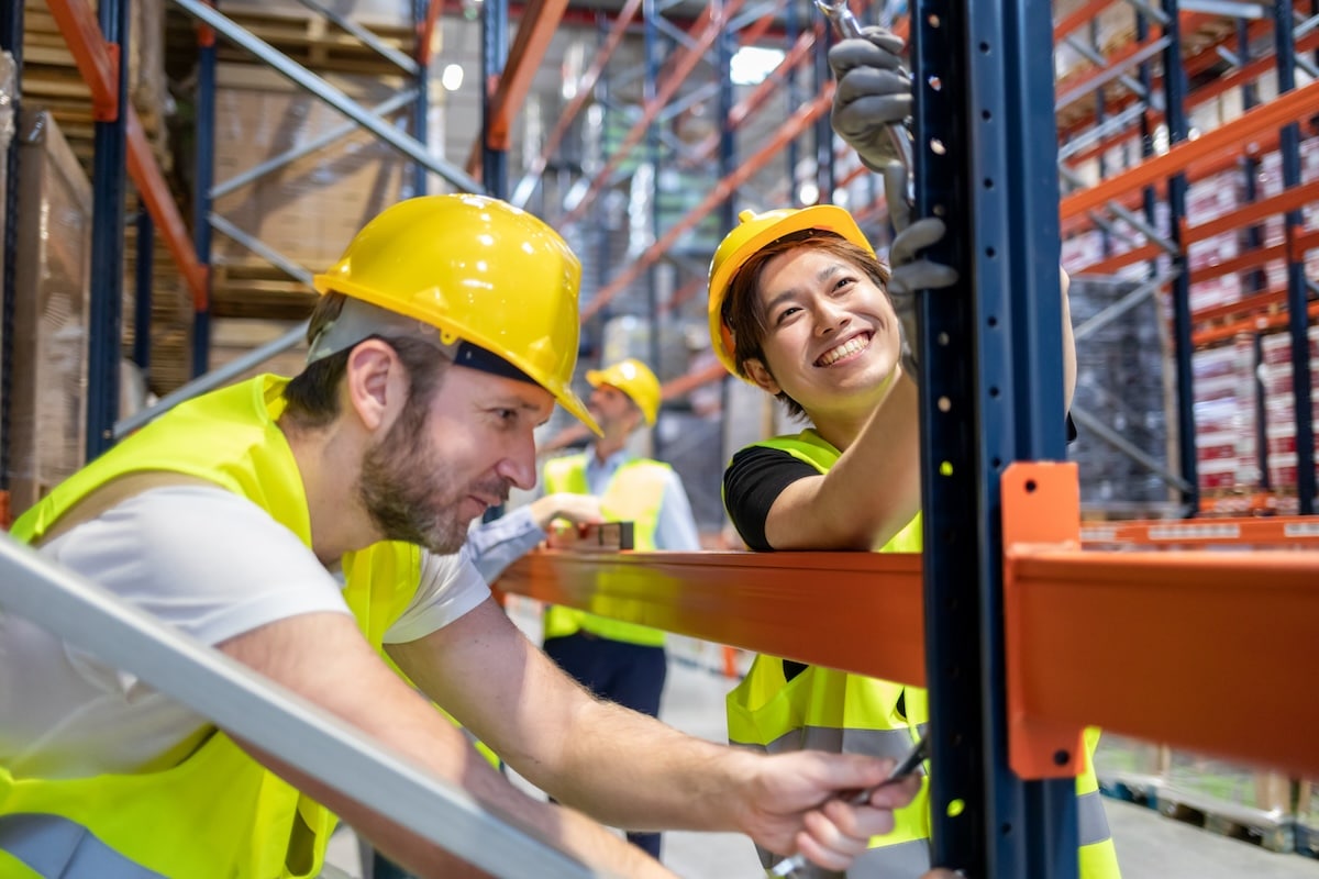 workers learning how to assemble warehouse shelving